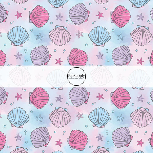 This pastel fabric by the yard features watercolor pink, blue, and purple sea shells. This fun summer themed fabric can be used for all your sewing and crafting needs!