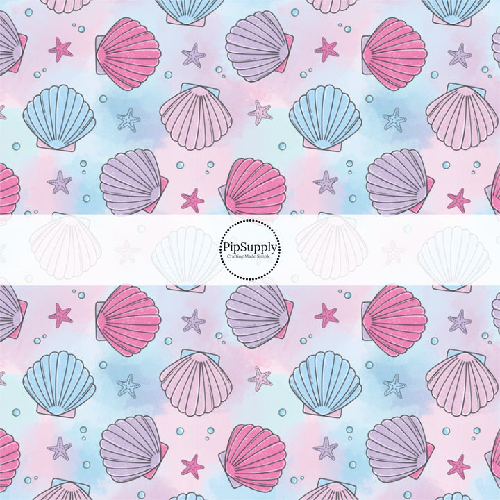 This pastel fabric by the yard features watercolor pink, blue, and purple sea shells. This fun summer themed fabric can be used for all your sewing and crafting needs!