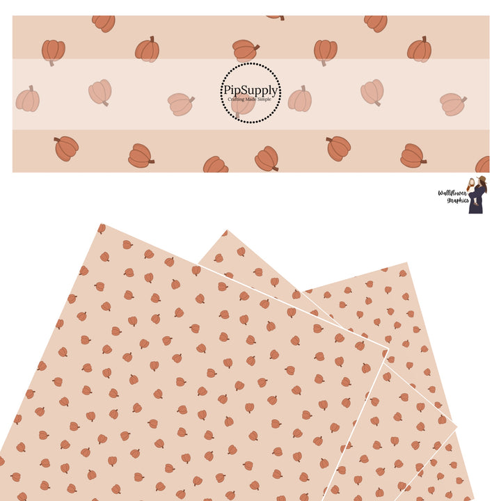 Tiny orange pumpkins scattered on peach faux leather sheets