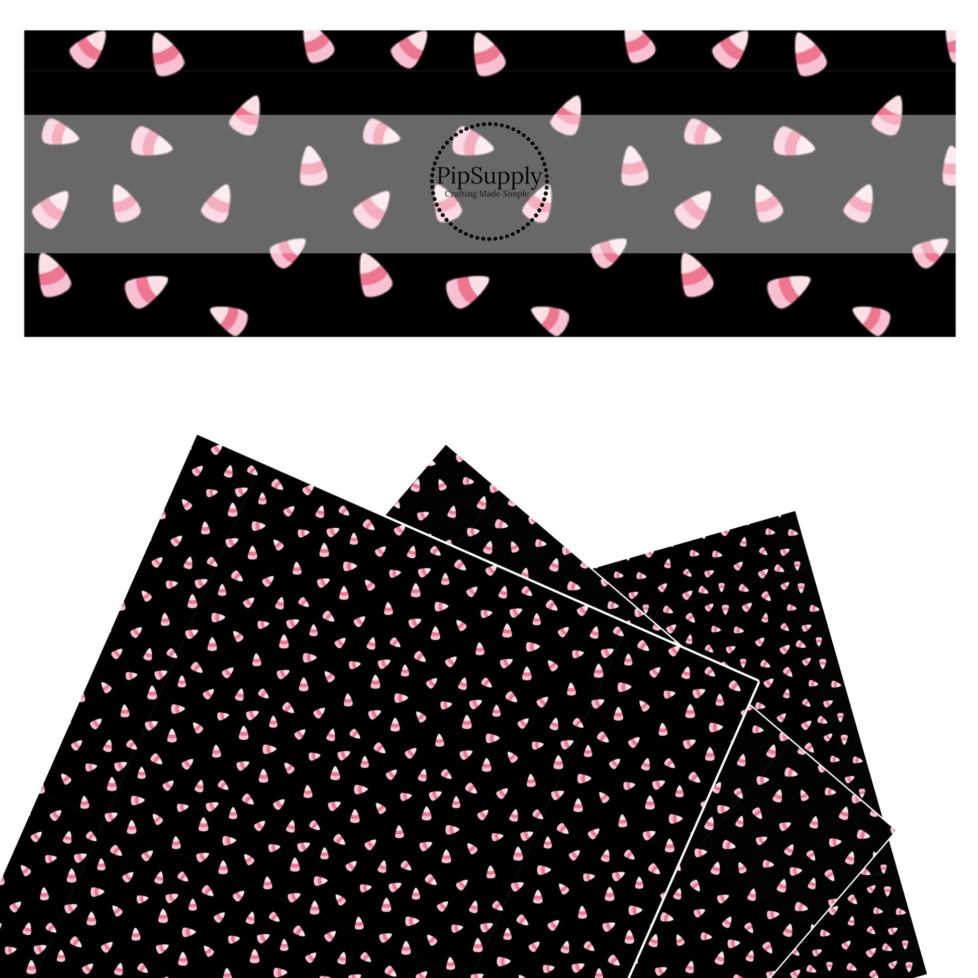 Pink candy corn scattered on black faux leather sheets