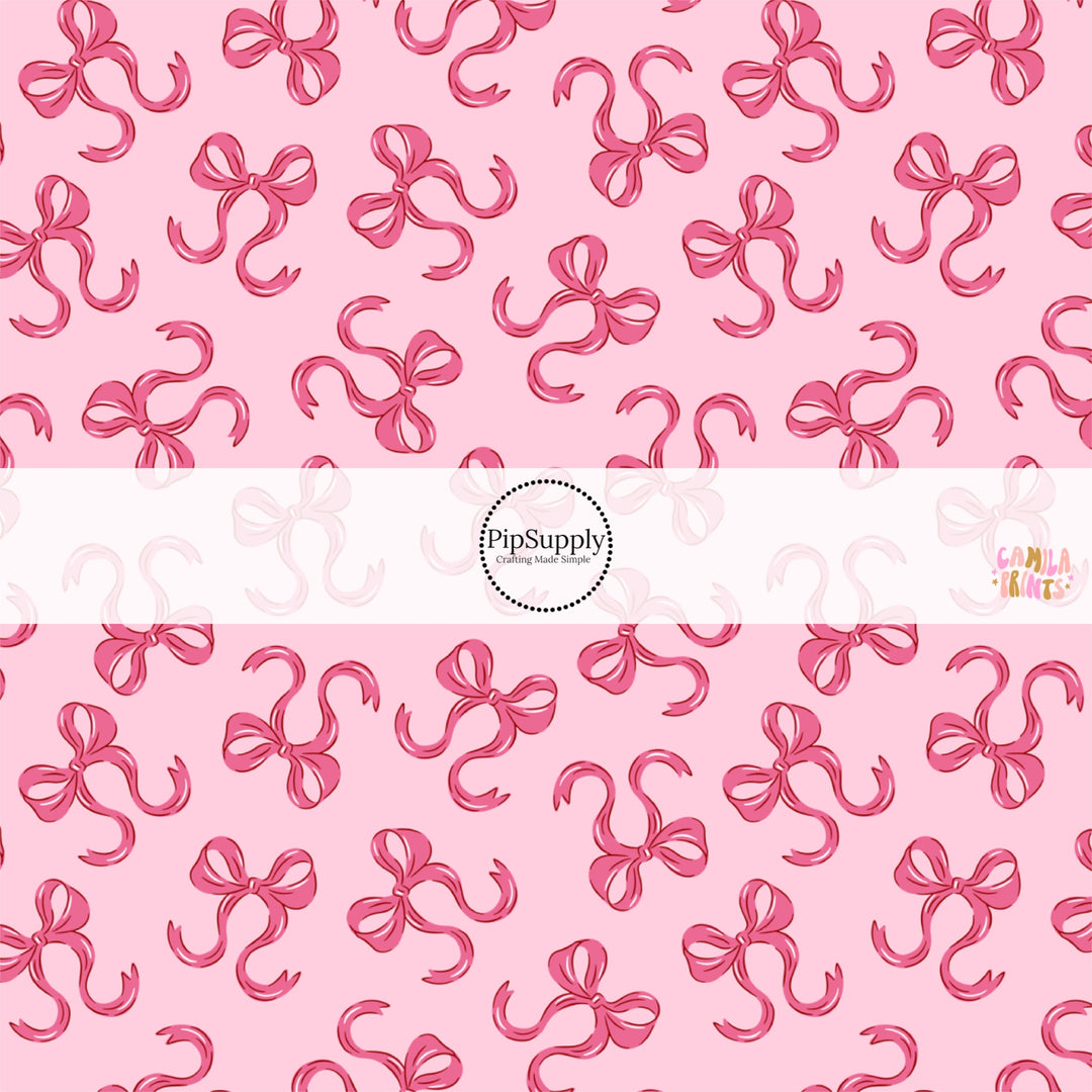 This holiday fabric by the yard features bows on pink. This festive pattern fabric can be used for all your sewing and crafting needs!