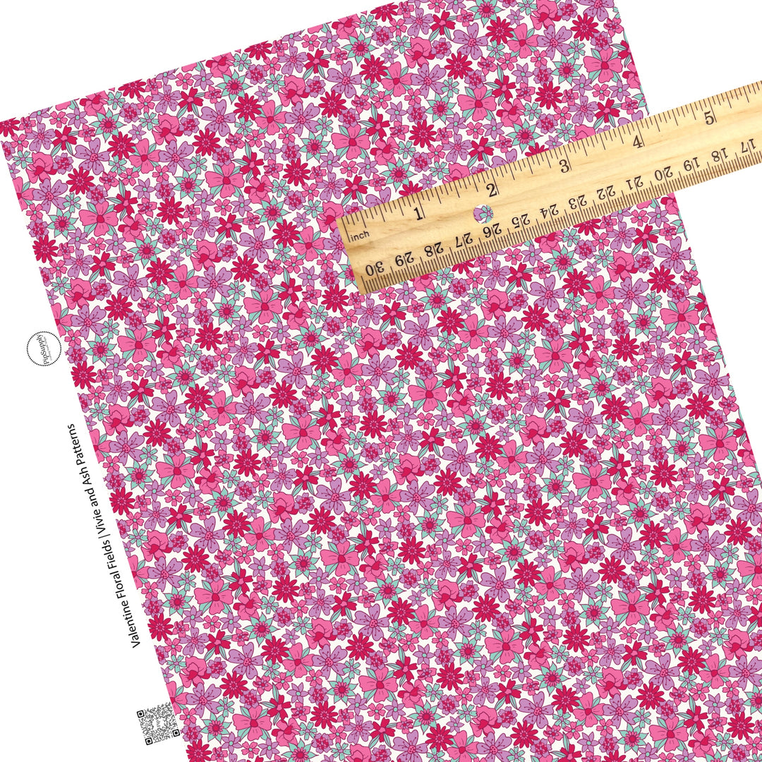 These Valentine's Day pattern faux leather sheets contain the following design elements: pink, purple, red, and mint flowers on white. Our CPSIA compliant faux leather sheets or rolls can be used for all types of crafting projects.