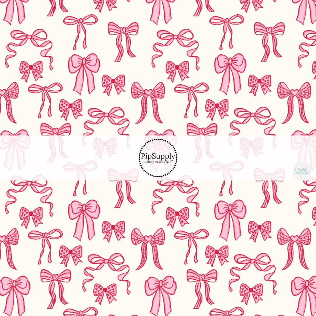 This holiday fabric by the yard features pink Valentine bows. This festive pattern fabric can be used for all your sewing and crafting needs!