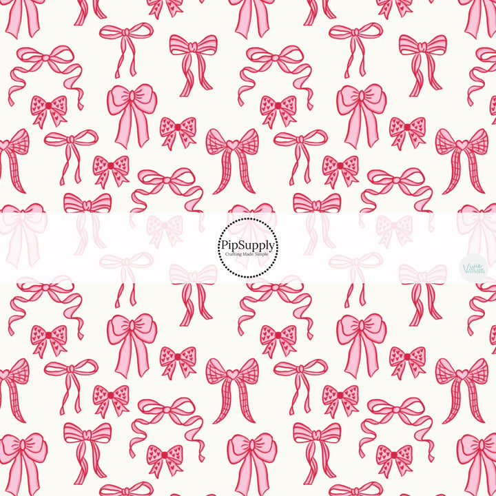 This holiday fabric by the yard features pink Valentine bows. This festive pattern fabric can be used for all your sewing and crafting needs!