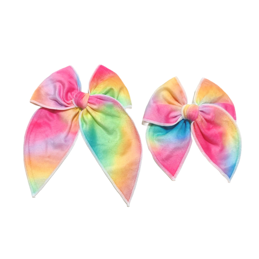 These rainbow tie dye velvet pre-cut tied bows are ready to package and resell to your customers no sewing or measuring necessary! These hair bows come with a alligator clip already attached.