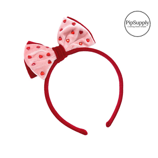 Red heart embellishments on pink and red velvet bow headband