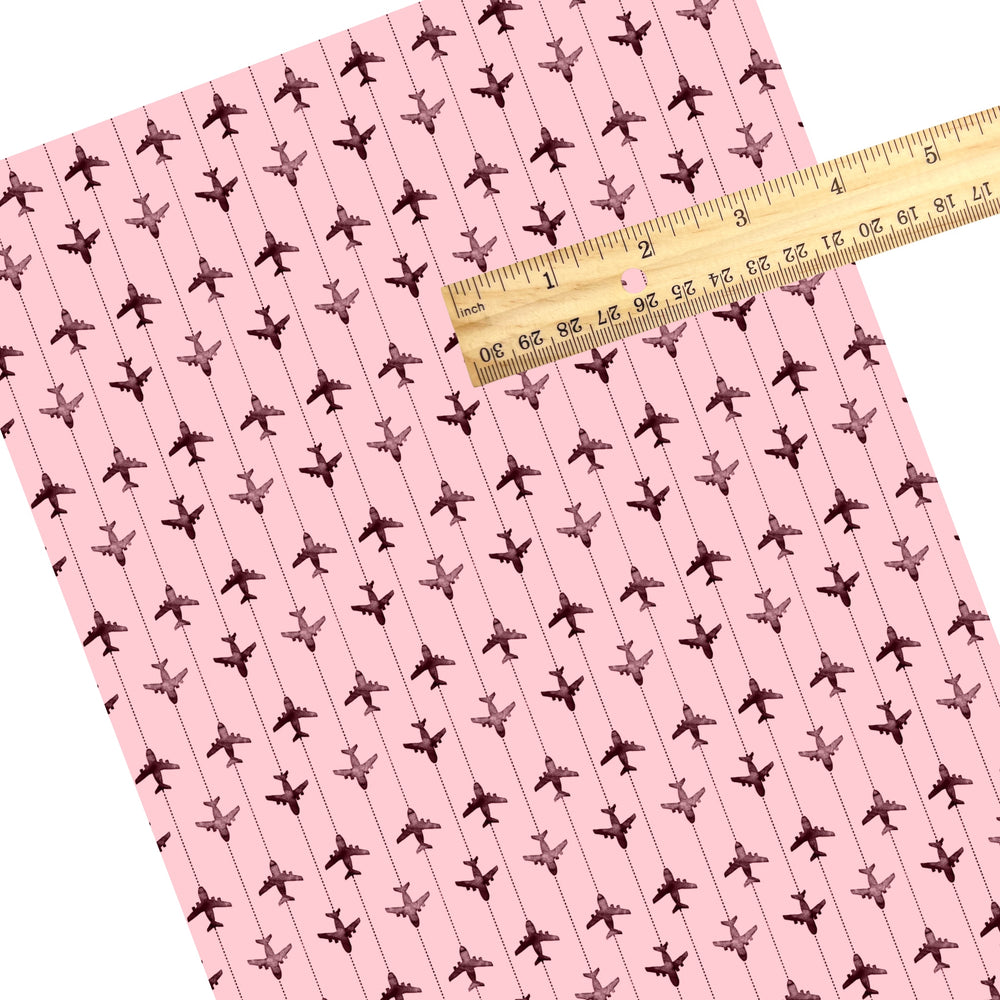These travel themed faux leather sheets contain the following design elements: airplanes on pink pattern. Our CPSIA compliant faux leather sheets or rolls can be used for all types of crafting projects.
