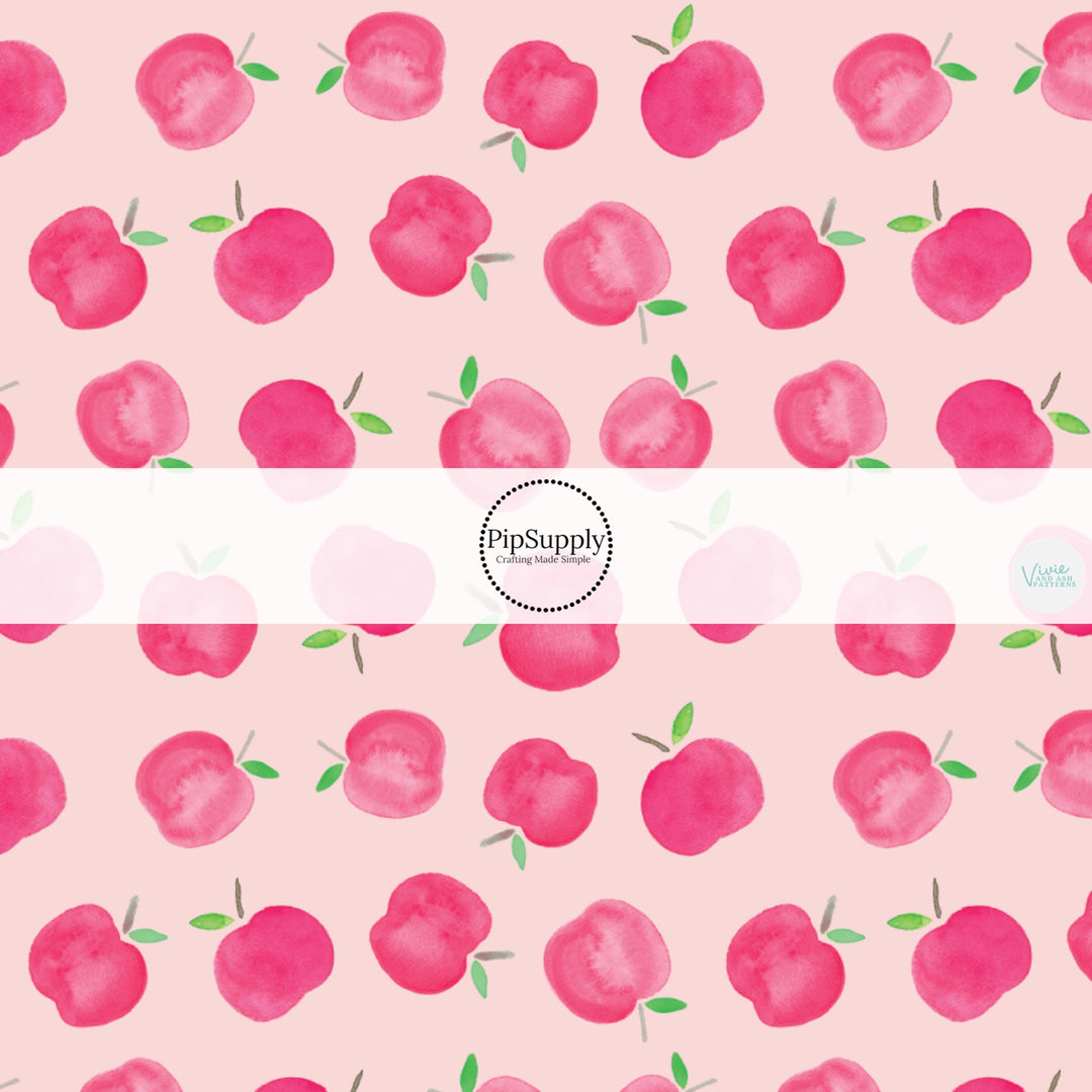 These school themed fabric by the yard features pink apples on light pink. This fun themed fabric can be used for all your sewing and crafting needs!