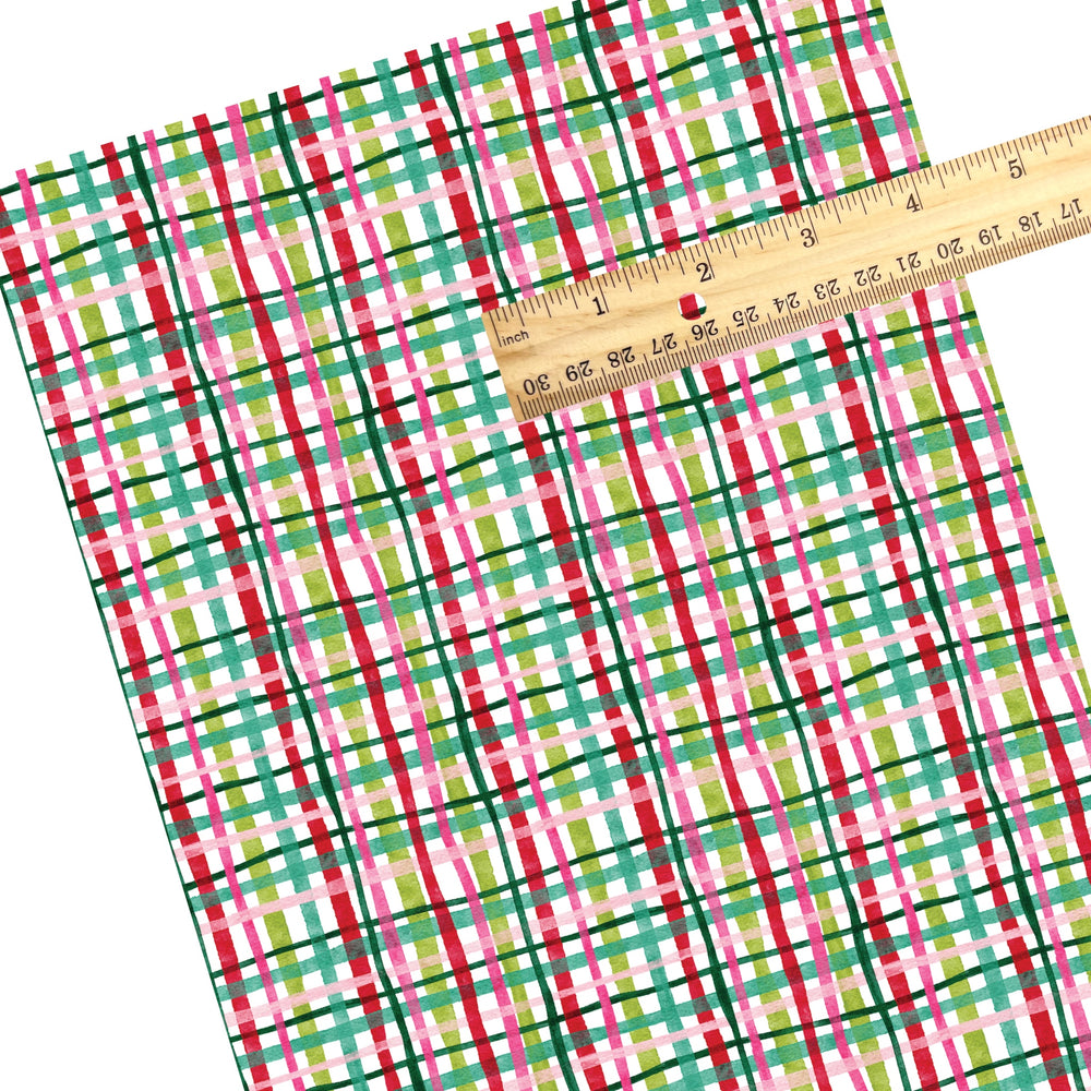 These winter plaid themed pattern faux leather sheets contain the following design elements: colorful Christmas plaid. Our CPSIA compliant faux leather sheets or rolls can be used for all types of crafting projects.