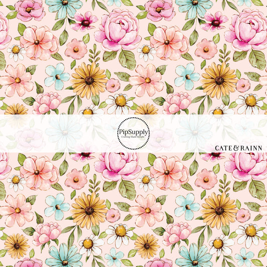 These floral themed pink fabric by the yard features light pink, orange, white and blue watercolor floral flowers on light pink. This fun floral summer themed fabric can be used for all your sewing and crafting needs! 