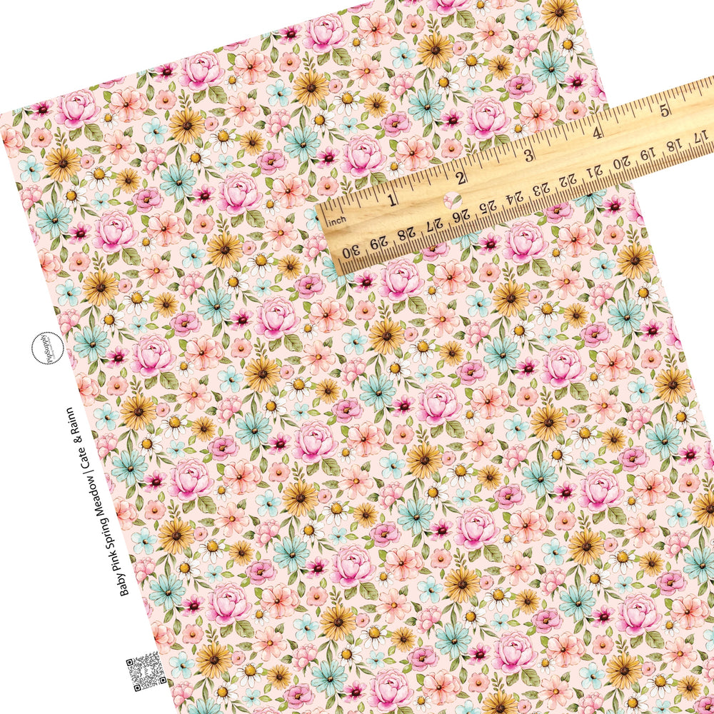 These floral themed pink faux leather sheets contain the following design elements: pink, orange, blue, and white watercolor floral flowers on light pink. Our CPSIA compliant faux leather sheets or rolls can be used for all types of crafting projects. 