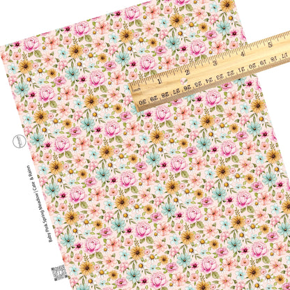 These floral themed pink faux leather sheets contain the following design elements: pink, orange, blue, and white watercolor floral flowers on light pink. Our CPSIA compliant faux leather sheets or rolls can be used for all types of crafting projects. 