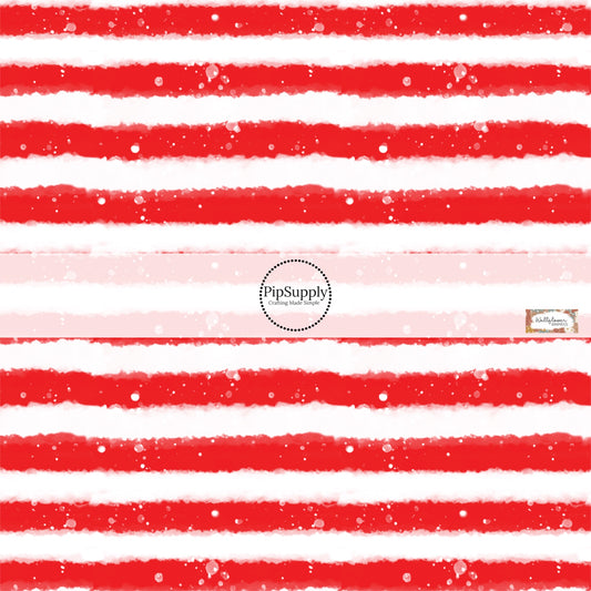 This 4th of July fabric by the yard features patriotic white and red stripes. This pattern has a watercolor appearance. This fun patriotic themed fabric can be used for all your sewing and crafting needs!