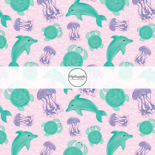 This ocean fabric by the yard features sea creatures on pink. This fun summer themed fabric can be used for all your sewing and crafting needs!