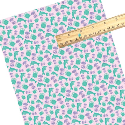 These beach faux leather sheets contain the following design elements: sea creatures on pink. Our CPSIA compliant faux leather sheets or rolls can be used for all types of crafting projects.
