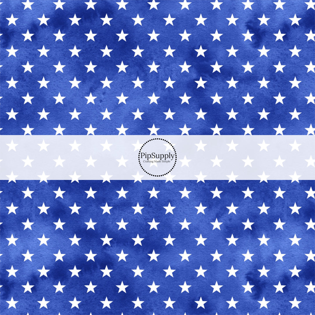 These patriotic fabric by the yard features white stars on blue. This fun pattern fabric can be used for all your sewing and crafting needs!