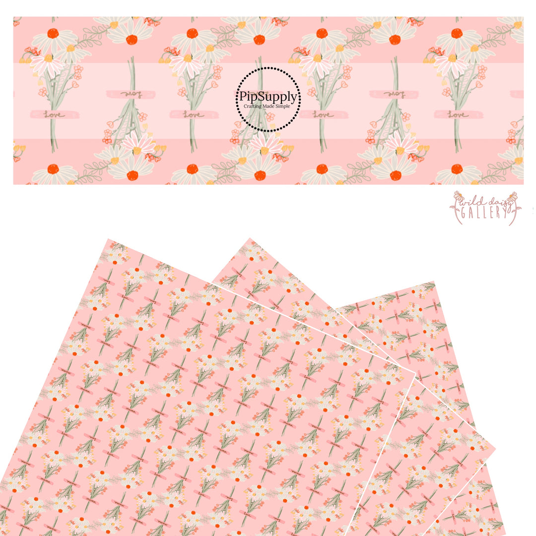 These wildflower daisy themed light pink faux leather sheets contain the following design elements: white, cream, yellow, and orange daisy flower bouquets with pink ribbons. 