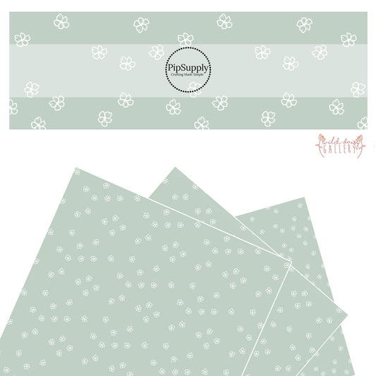 These daisy themed light seafoam green faux leather sheets contain the following design elements: white outlined daisies on seafoam. 