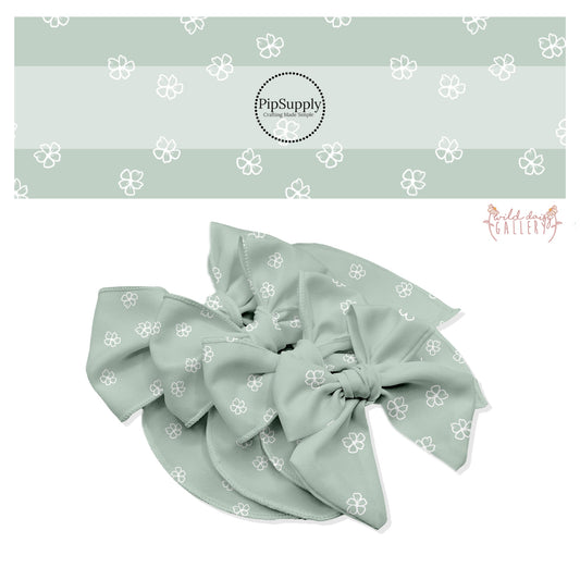 These fun summer floral themed bow strips features white outlined daisies on seafoam are great for personal use or to sell.