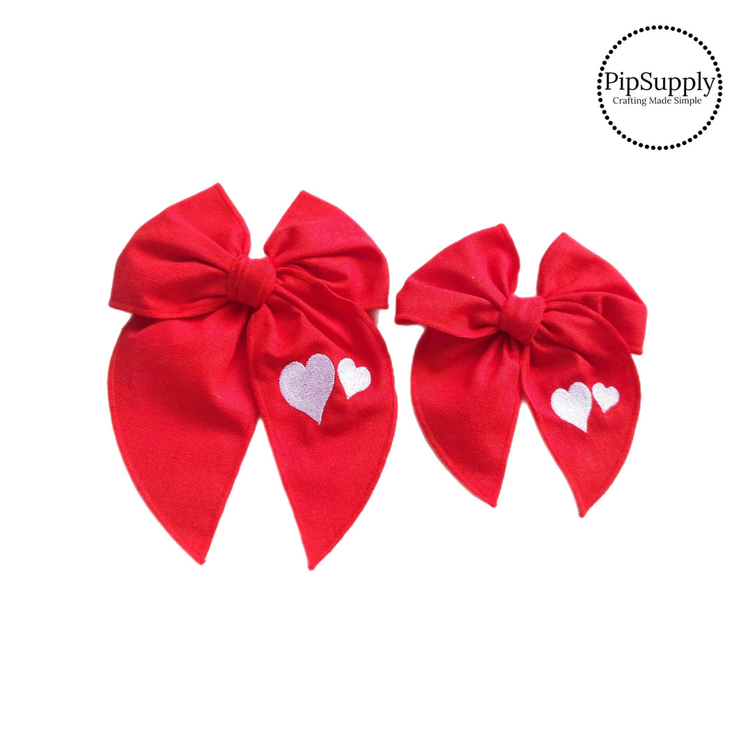 These Valentine red embroidered tied bows are ready to package and resell to your customers no sewing or measuring necessary! These hair bows come with a alligator clip already attached. Along with white embroidered hearts.