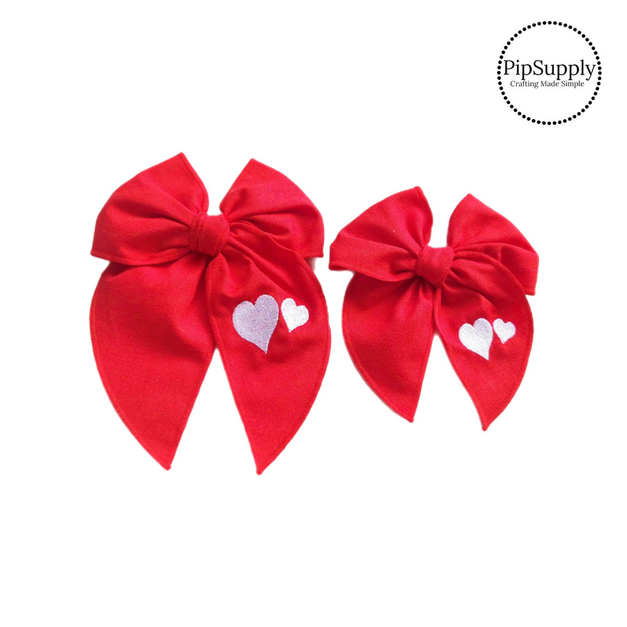 These Valentine red embroidered tied bows are ready to package and resell to your customers no sewing or measuring necessary! These hair bows come with a alligator clip already attached. Along with white embroidered hearts.