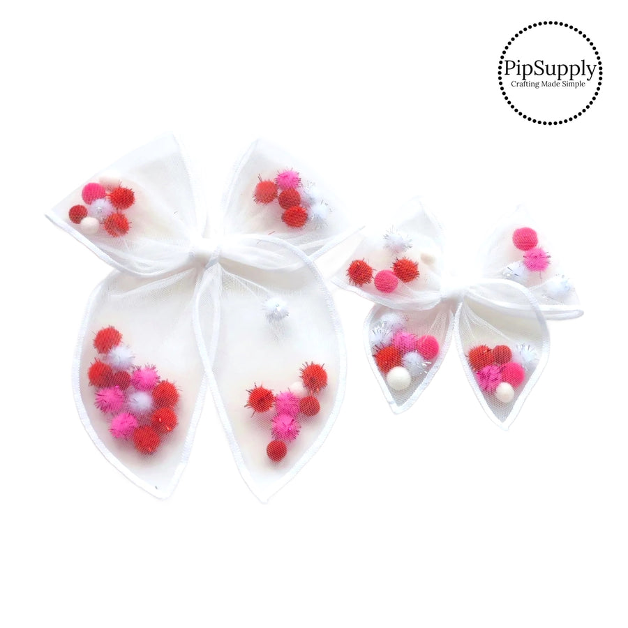 These Valentine's Day white stitched white tulle pre-cut shaker tied bows are ready to package and resell to your customers no sewing or measuring necessary! These hair bows come with a alligator clip already attached and come filled with colorful pompoms.