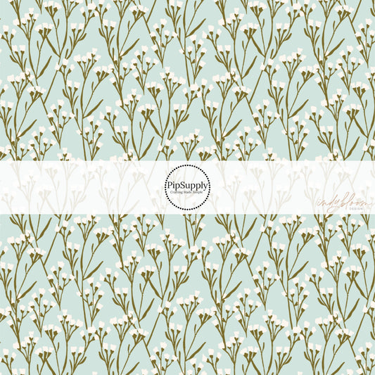 This summer fabric by the yard features cream wildflowers on light blue. This fun summer themed fabric can be used for all your sewing and crafting needs!