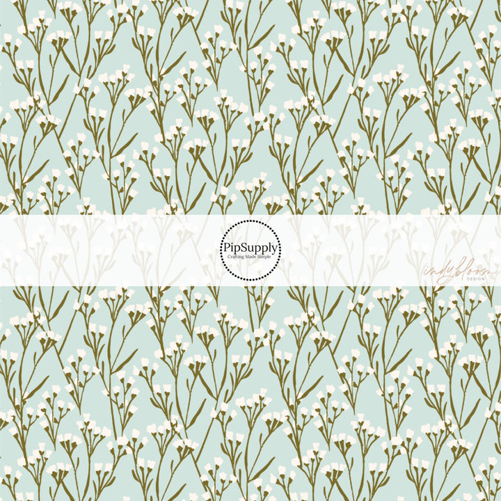 This summer fabric by the yard features cream wildflowers on light blue. This fun summer themed fabric can be used for all your sewing and crafting needs!