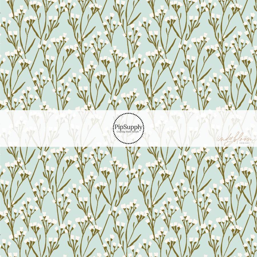 This summer fabric by the yard features cream wildflowers on light blue. This fun summer themed fabric can be used for all your sewing and crafting needs!