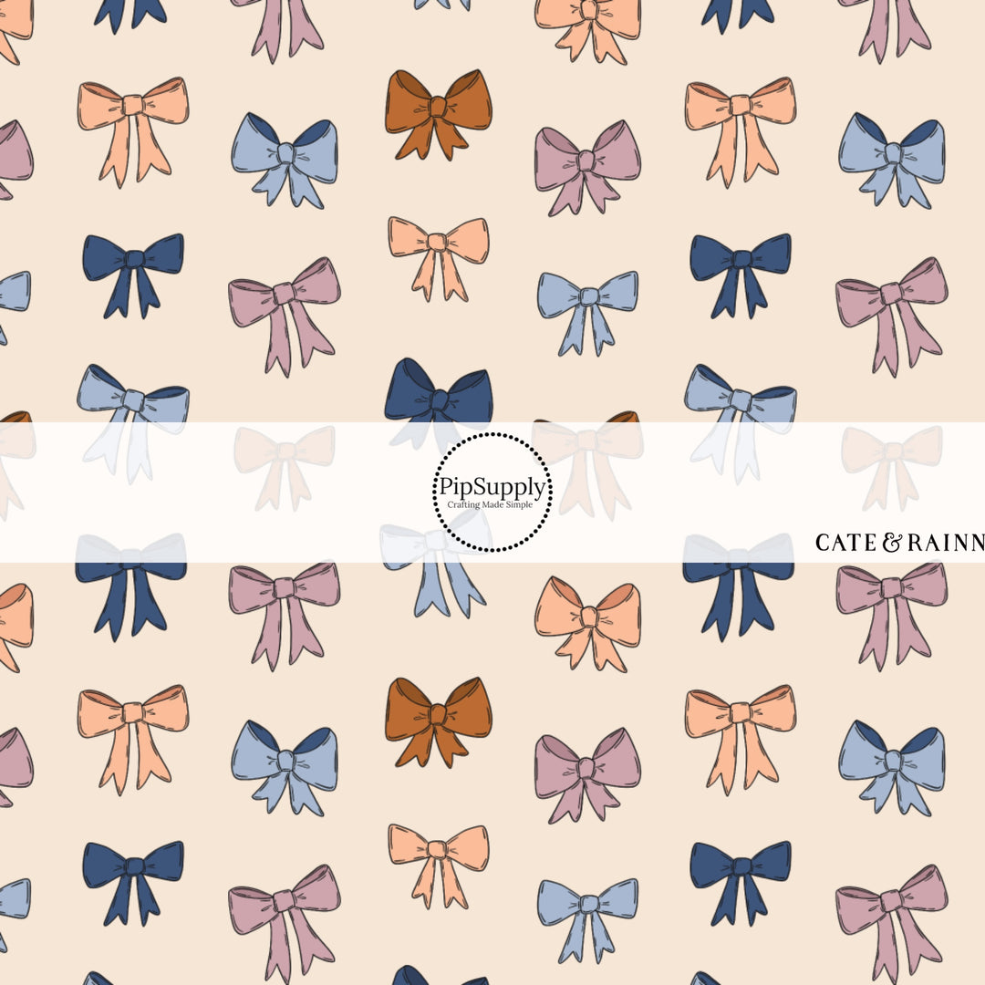 These winter bow themed pattern fabric by the yard features the following design elements: berry colored bows on cream. This fun themed fabric can be used for all your sewing and crafting needs!