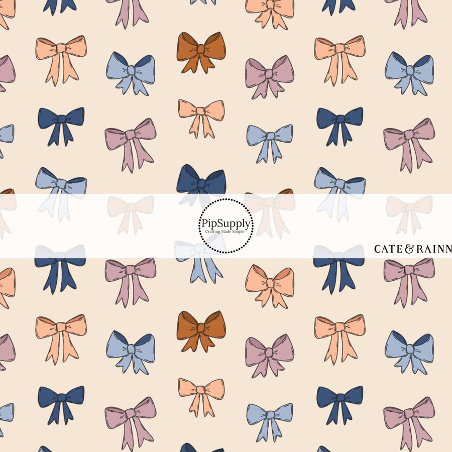 These winter bow themed pattern fabric by the yard features the following design elements: berry colored bows on cream. This fun themed fabric can be used for all your sewing and crafting needs!