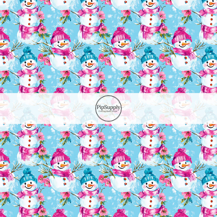 This winter snowman fabric by the yard features snowman with colorful hats on blue. This fun winter fabric can be used for all your sewing and crafting needs!