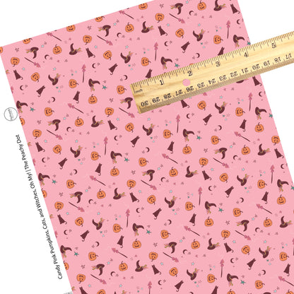 Scattered halloween friends with moons and stars on pink faux leather sheets