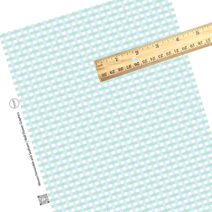 These spring pastel pattern themed faux leather sheets contain the following design elements: light blue and seafoam green plaid pattern. Our CPSIA compliant faux leather sheets or rolls can be used for all types of crafting projects.