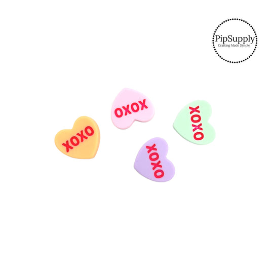 xoxo on orange, pink, lavender, and mint heart embellishment