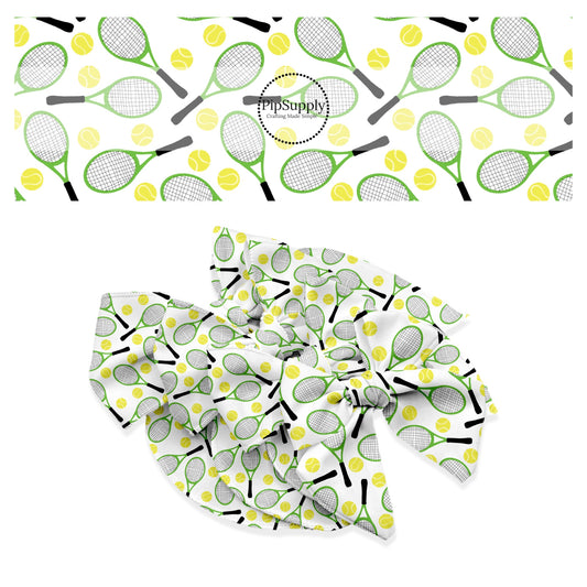 Small yellow tennis ball with green and black tennis racket on white bow strips
