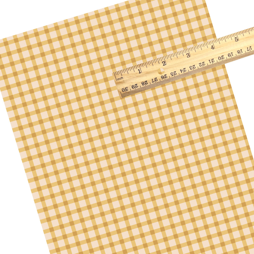 These summer faux leather sheets contain the following design elements: summer haze yellow and cream plaid pattern. Our CPSIA compliant faux leather sheets or rolls can be used for all types of crafting projects.