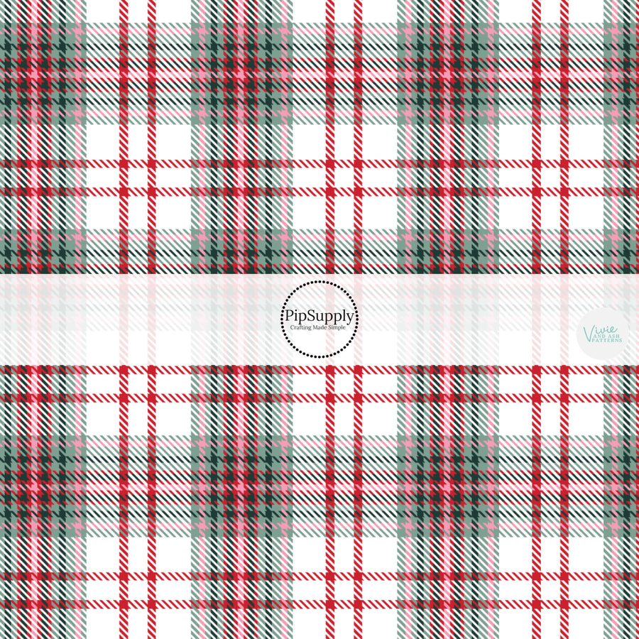 These winter yuletide plaid themed pattern fabric by the yard features the following design elements: Christmas red and green plaid pattern. This fun themed fabric can be used for all your sewing and crafting needs!