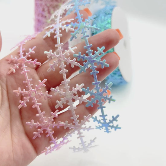 Snowflake trim with sparkles in pink, blue, and iridescent white