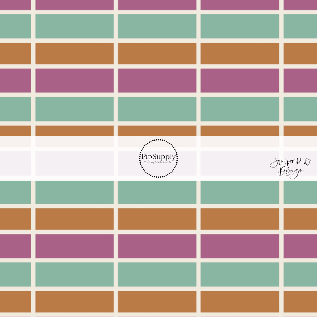 Plum, seafoam, and orange tiles seperated by cream lines on bow strips