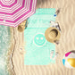 Bright Aqua blue leopard print beach towel laid out by the water at the beach. Custom Personalization