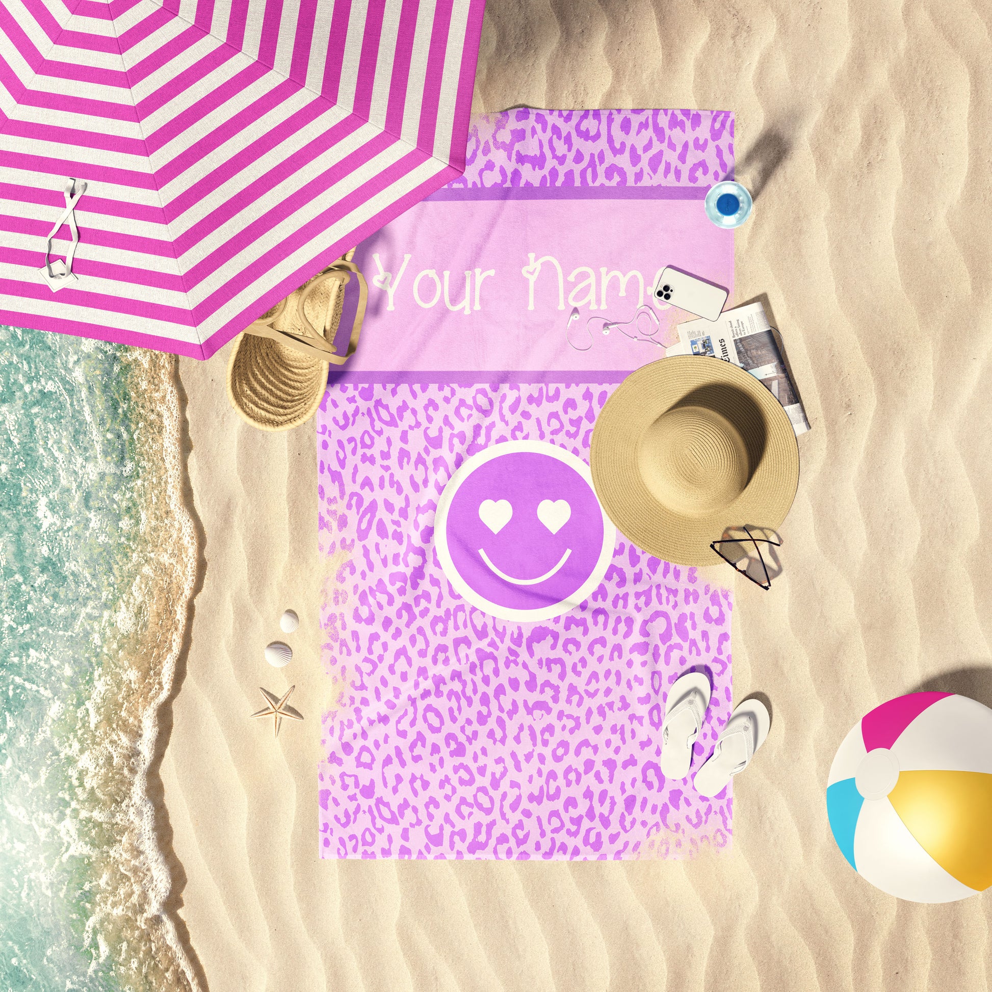 Purple and Lavender leopard print beach towel laid out by the water at the beach.