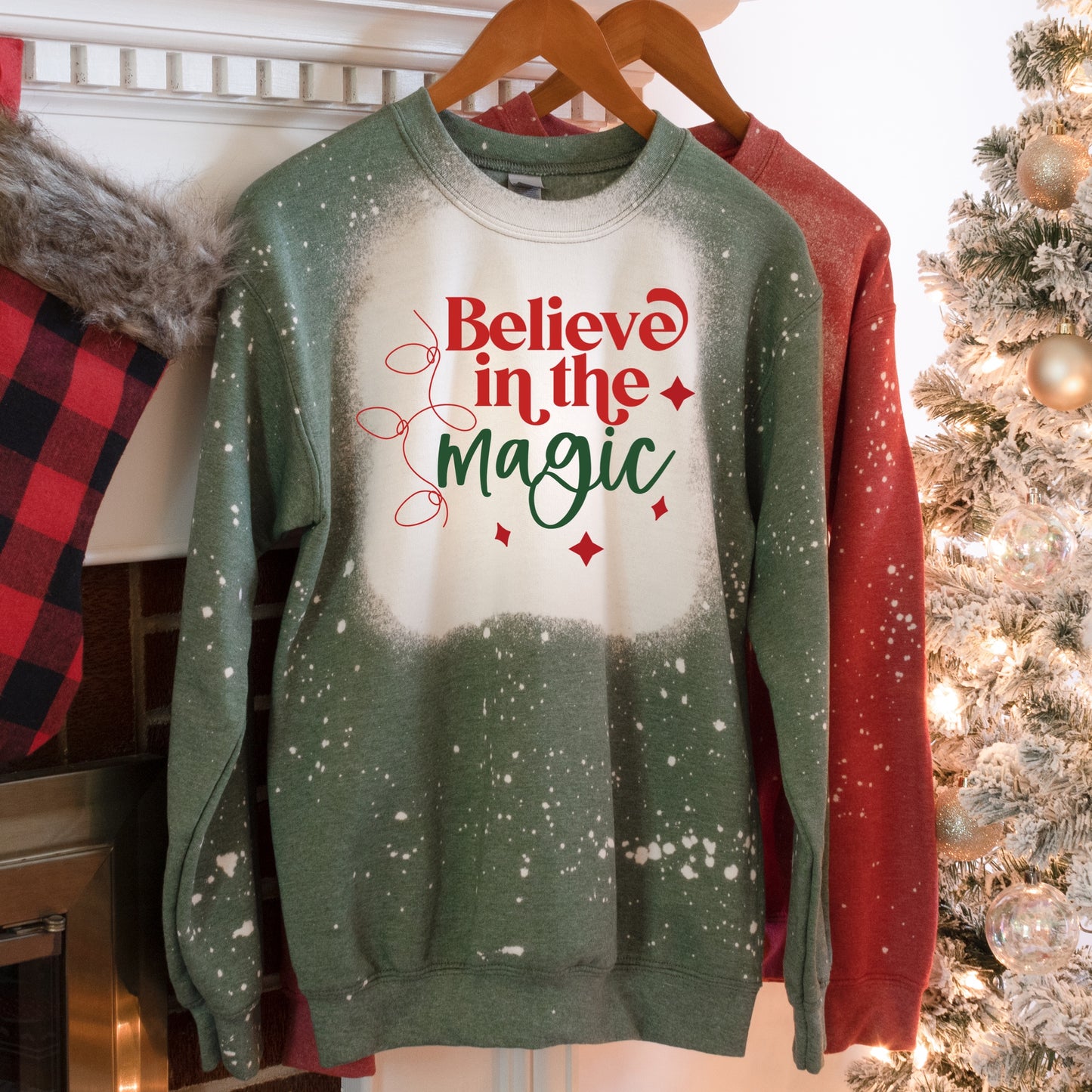 Green sweatshirt with a Christmas graphic that says "Believe in the magic" Iron on Transfers 