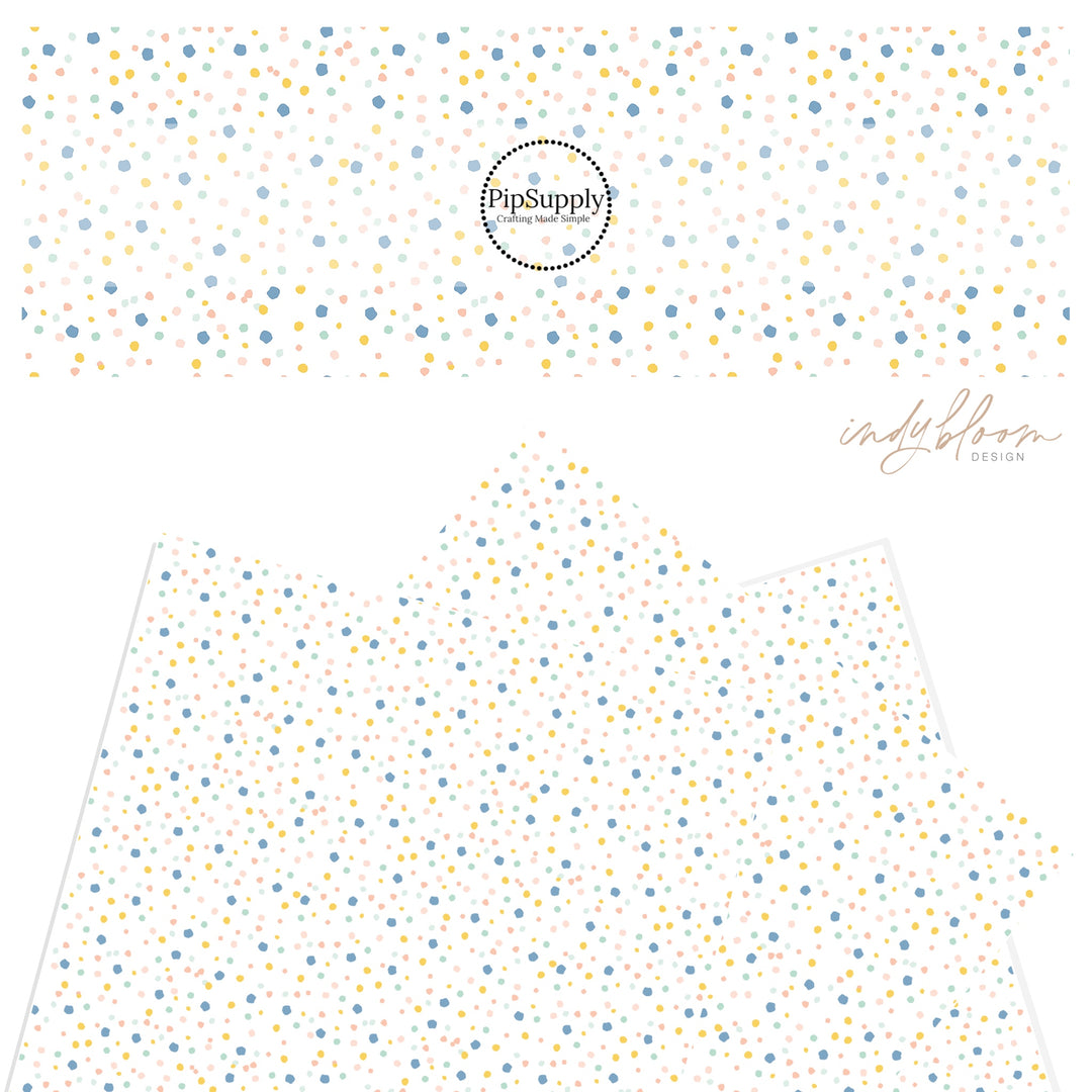 Pink, blue, yellow, mint green confetti dot pattern on a faux leather sheet.