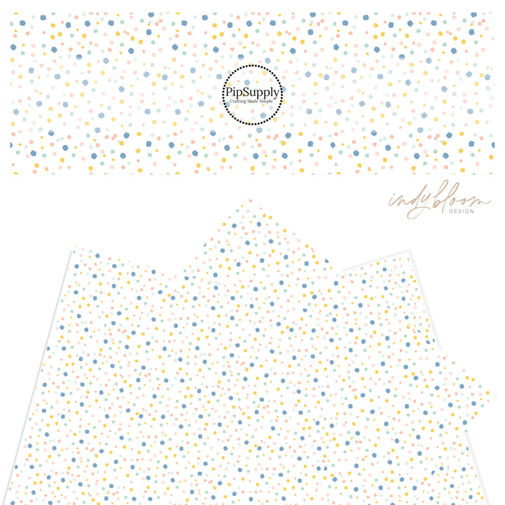 Pink, blue, yellow, mint green confetti dot pattern on a faux leather sheet.