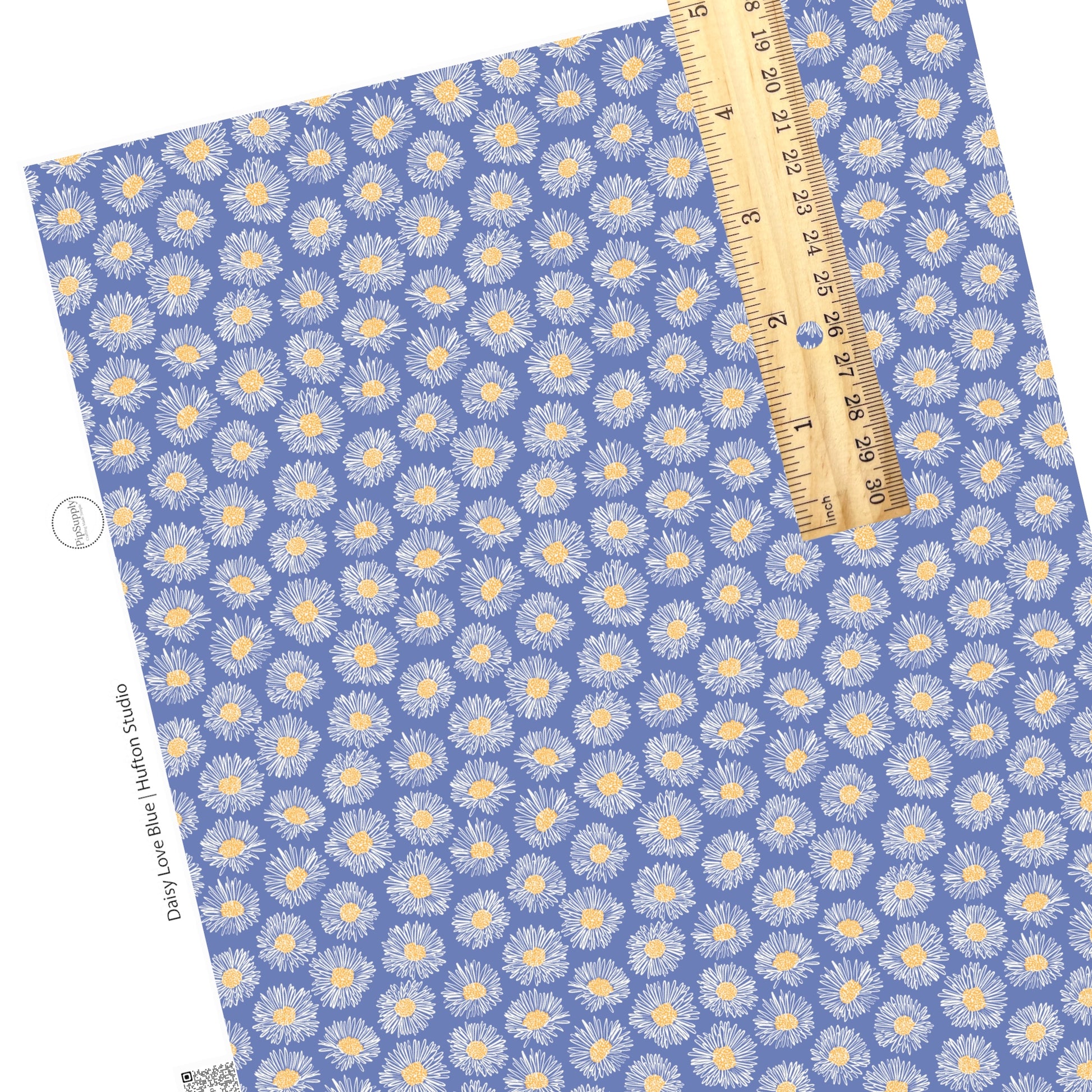White daisies with yellow center on blue faux leather sheet