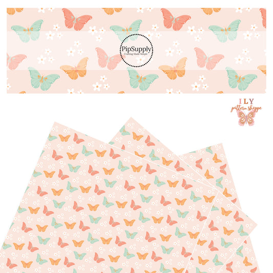 Orange, pink, and aqua floral butterflies on light pink faux leather sheet