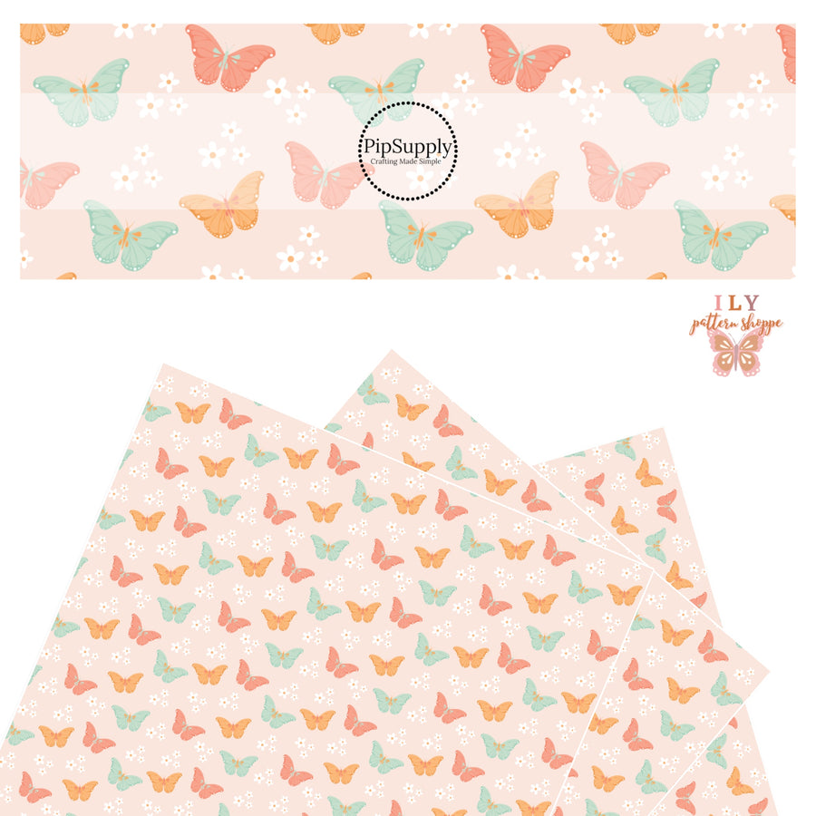 Orange, pink, and aqua floral butterflies on light pink faux leather sheet