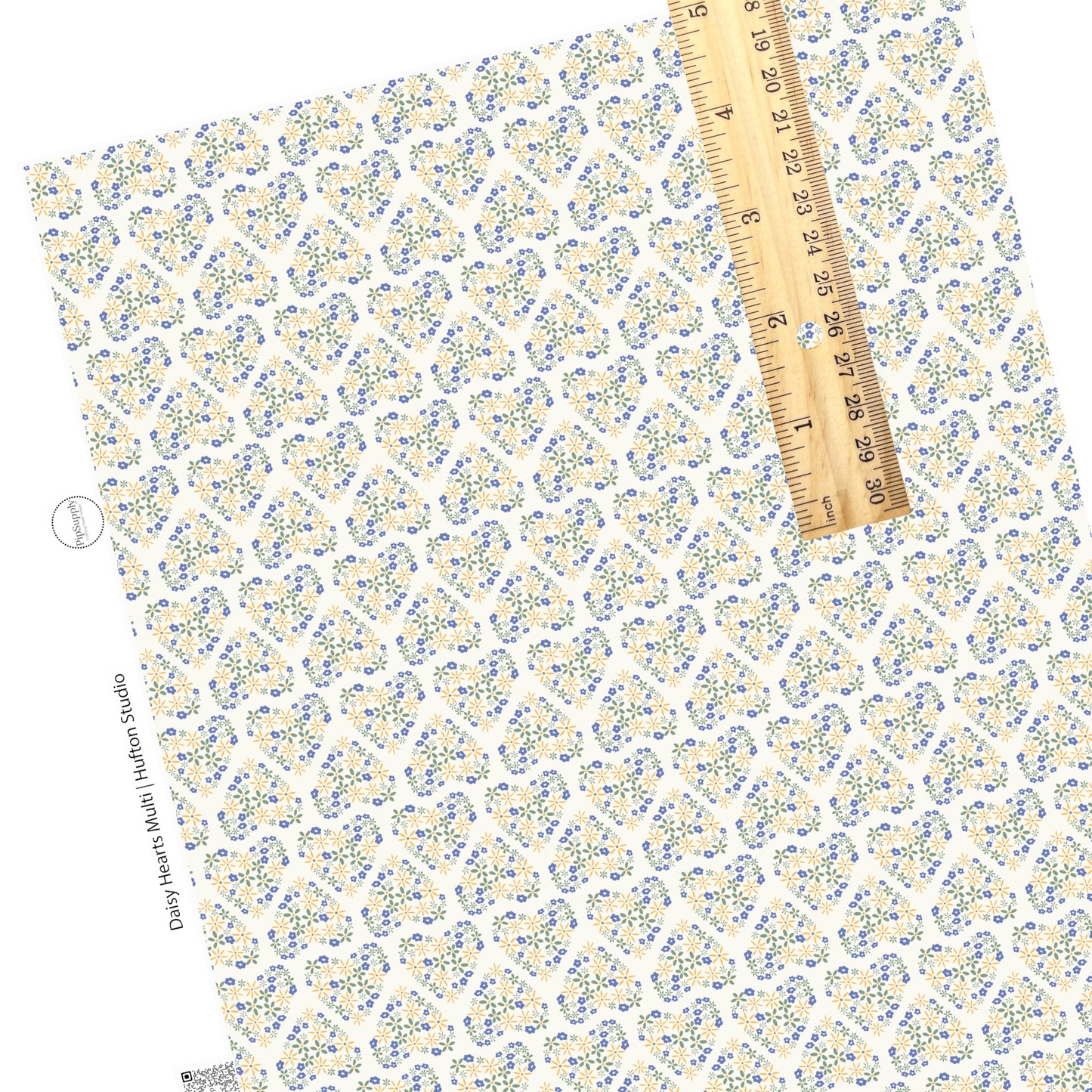 Spring blue, green, and yellow daisy hearts on cream faux leather sheet