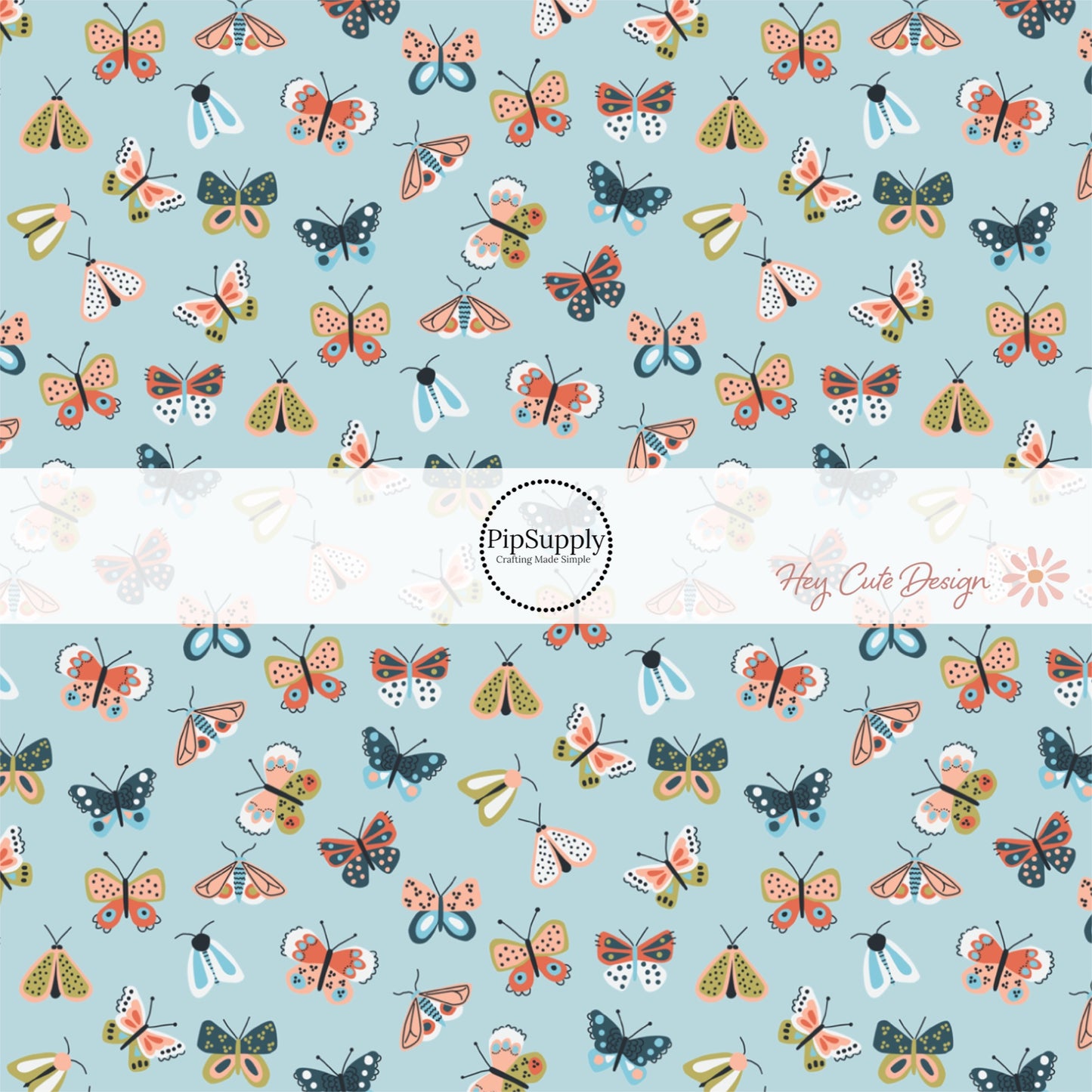 Colorful butterflies on light blue fabric by the yard